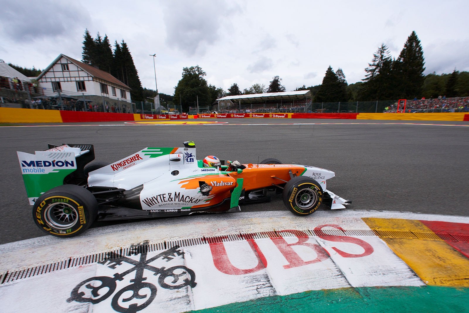 Paul di Resta, Force India, with a damaged side pod after the collision at the start with Glock