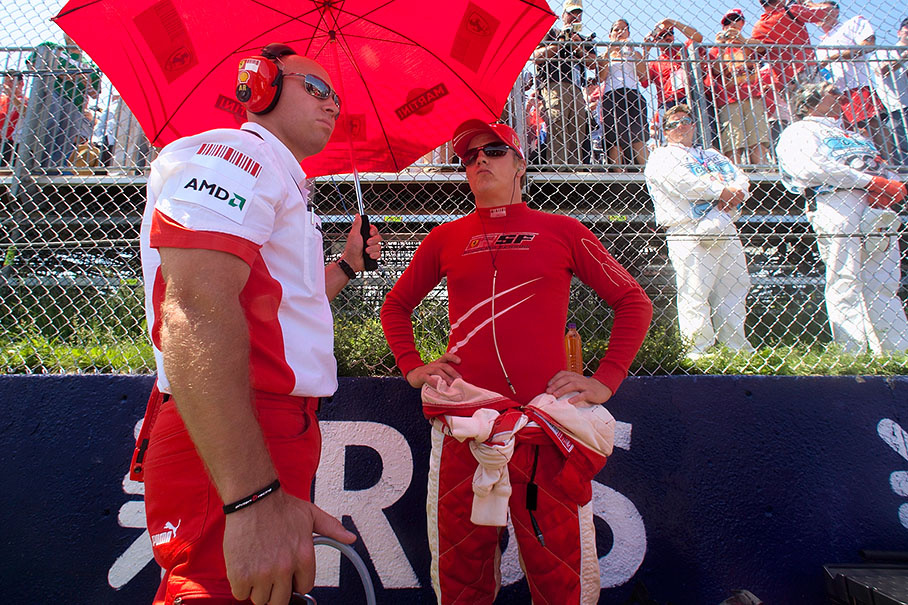 Kimi Raikkonen and his physio Mark Arnal wait on the grid
