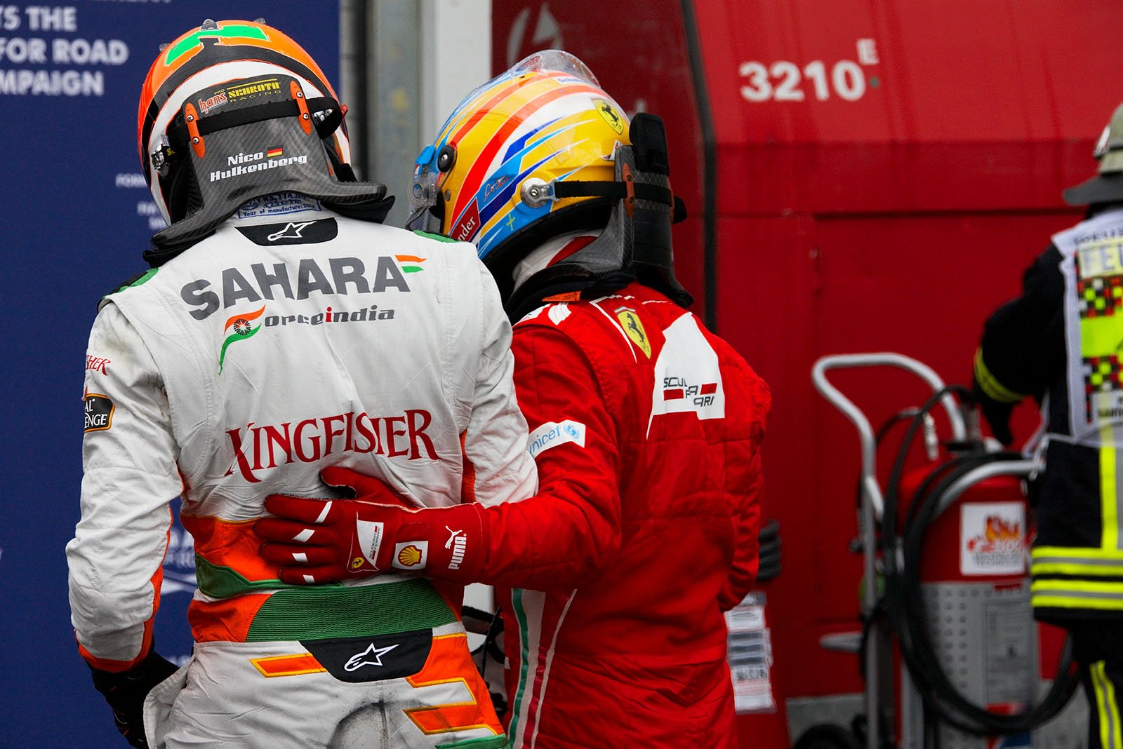 Polesetter Fernando Alonso hugs fifth positioned Nico Huelkenberg in parc ferme after qualifying