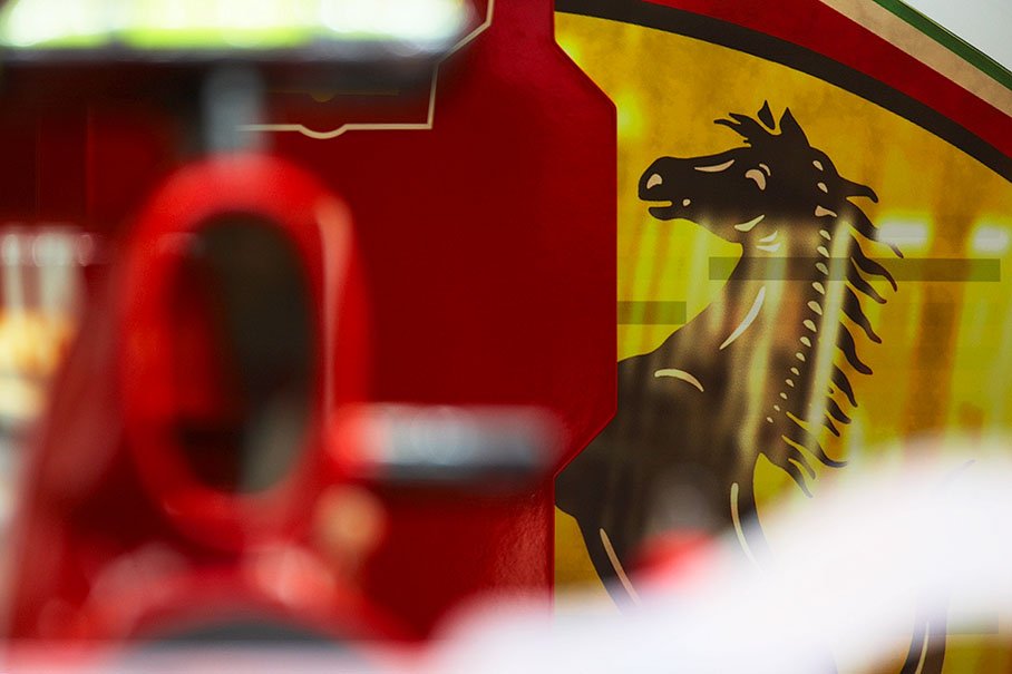 A black stallion prances at the back of Ferrari's pit