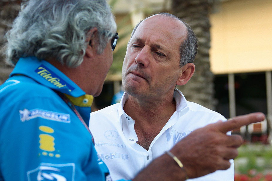 Ron Dennis smiling at Briatore