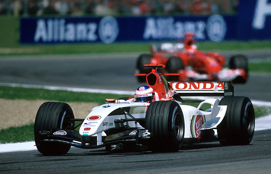 Jenson Button, BAR Honda, in front of Schumacher's Ferrari