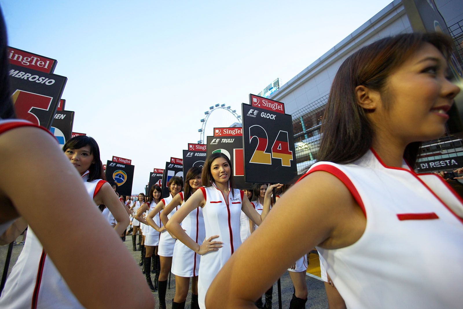 Grid girls hold the drivers number boards