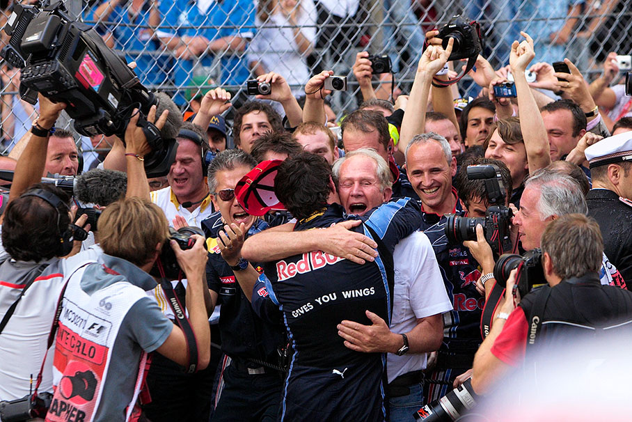 Race winner Mark Webber caresses Red Bull's Dr. Helmut Marko