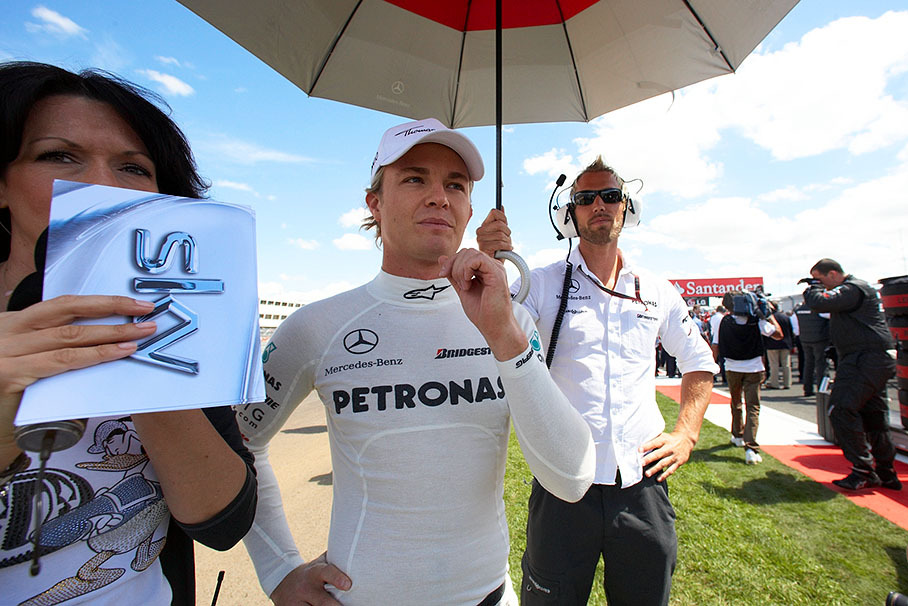 A confident Nico Rosberg, Mercedes GP, awaits an interview with the shy Sky TV presenter Tanja Bauer besides his promising 5th grid position
