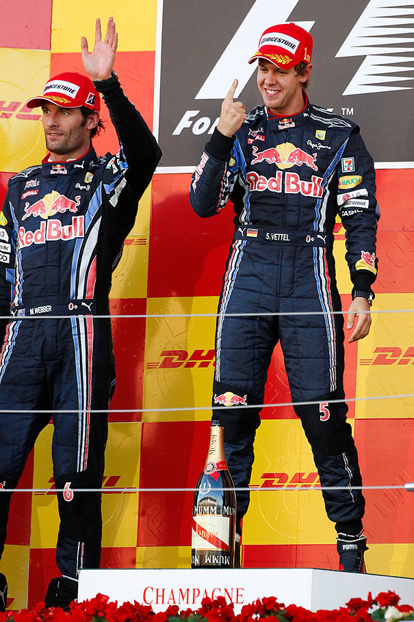 Race winner Sebastian Vettel celebrates on the podium after the Japanese GP 2010
