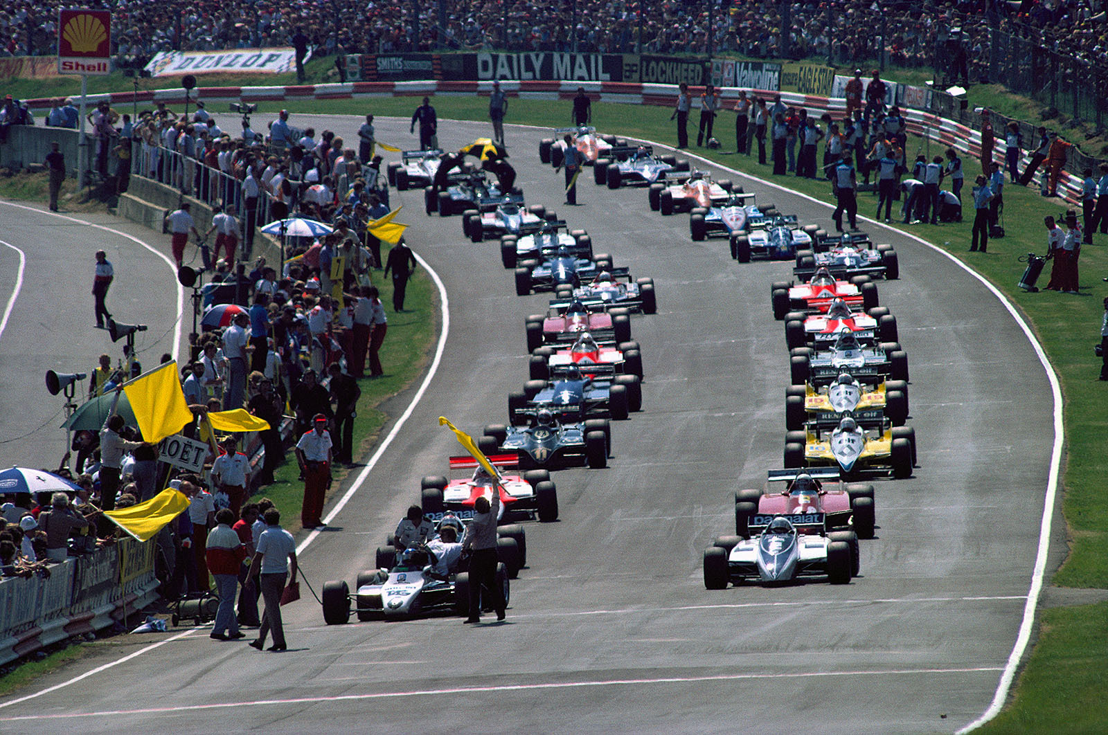 As the field goes on for the parade lap, Rosberg's Williams engine does not start and so Patrese, Brabham no. 2, becomes the pole position man