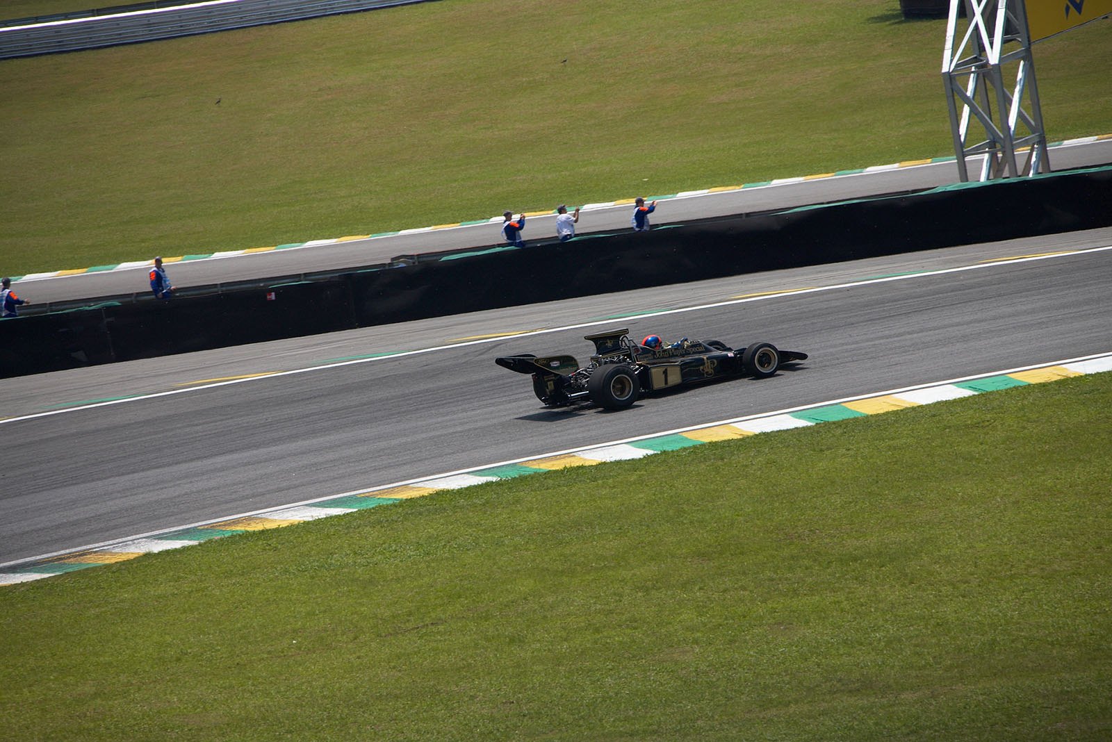 Emerson Fittipaldi showcasing the famous Lotus 72 motor car.