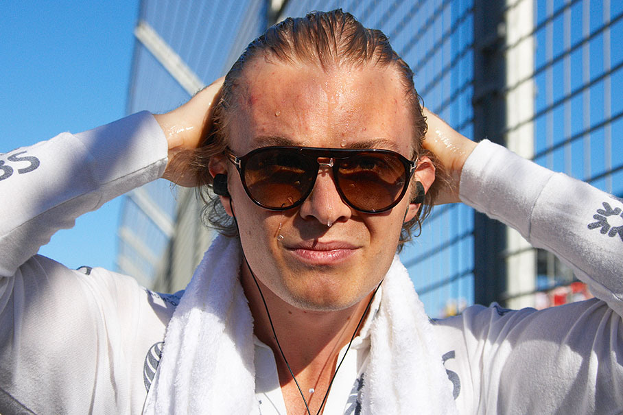 Nico Rosberg cools down with water besides the grid