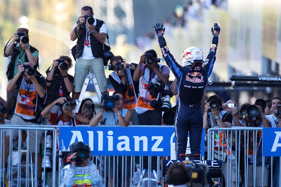 Race winner Sebastian Vettel celebrates in parc ferme