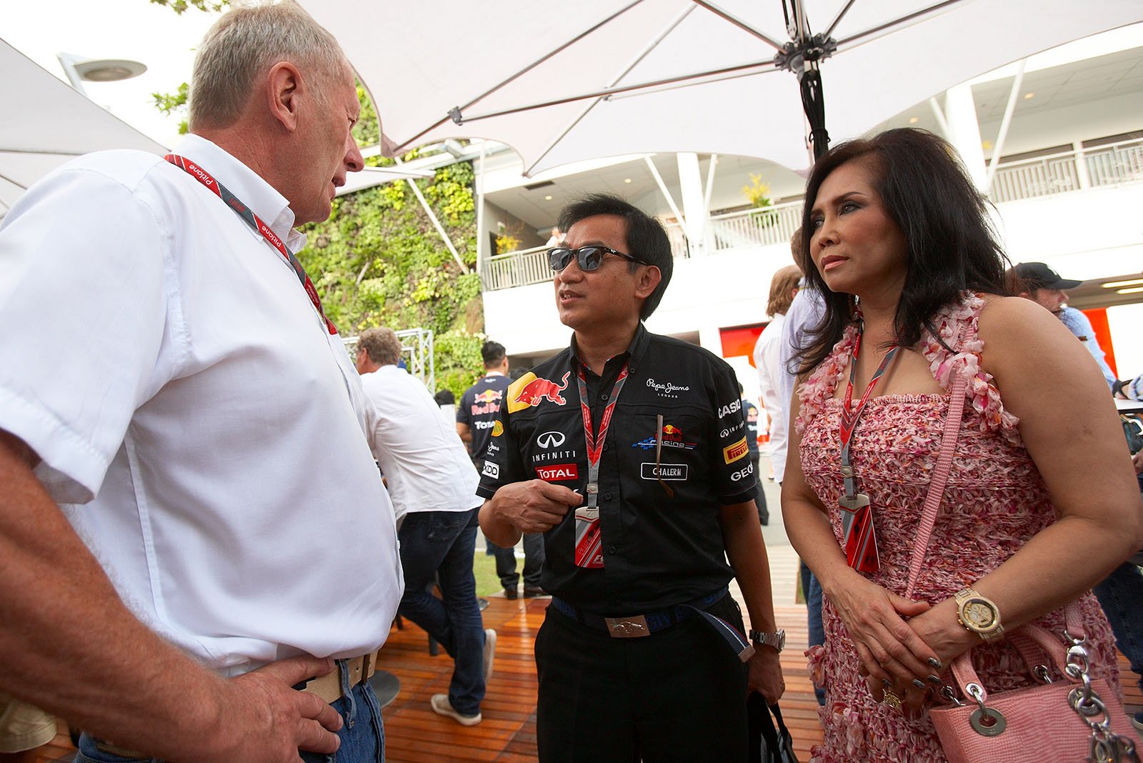 Red Bull Racing advisor Dr. Helmut Marko chats with Red Bull co-owner Chalerm Yoovidhya and his wife Daranee