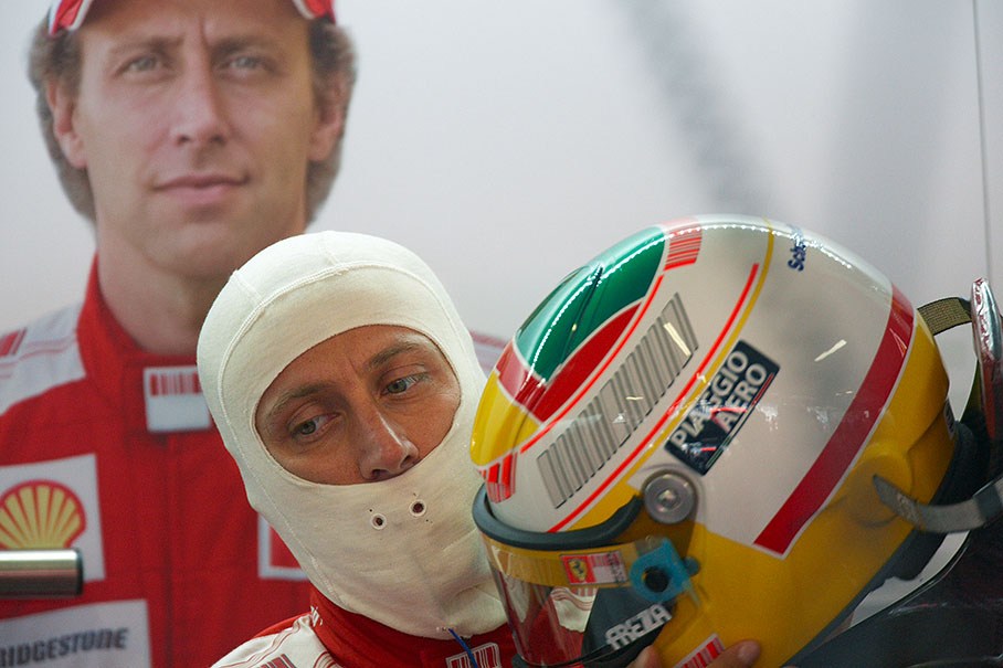 Ferrari's test driver Luca Badoer, who replaces the injured Felipe Massa, puts his helmet on