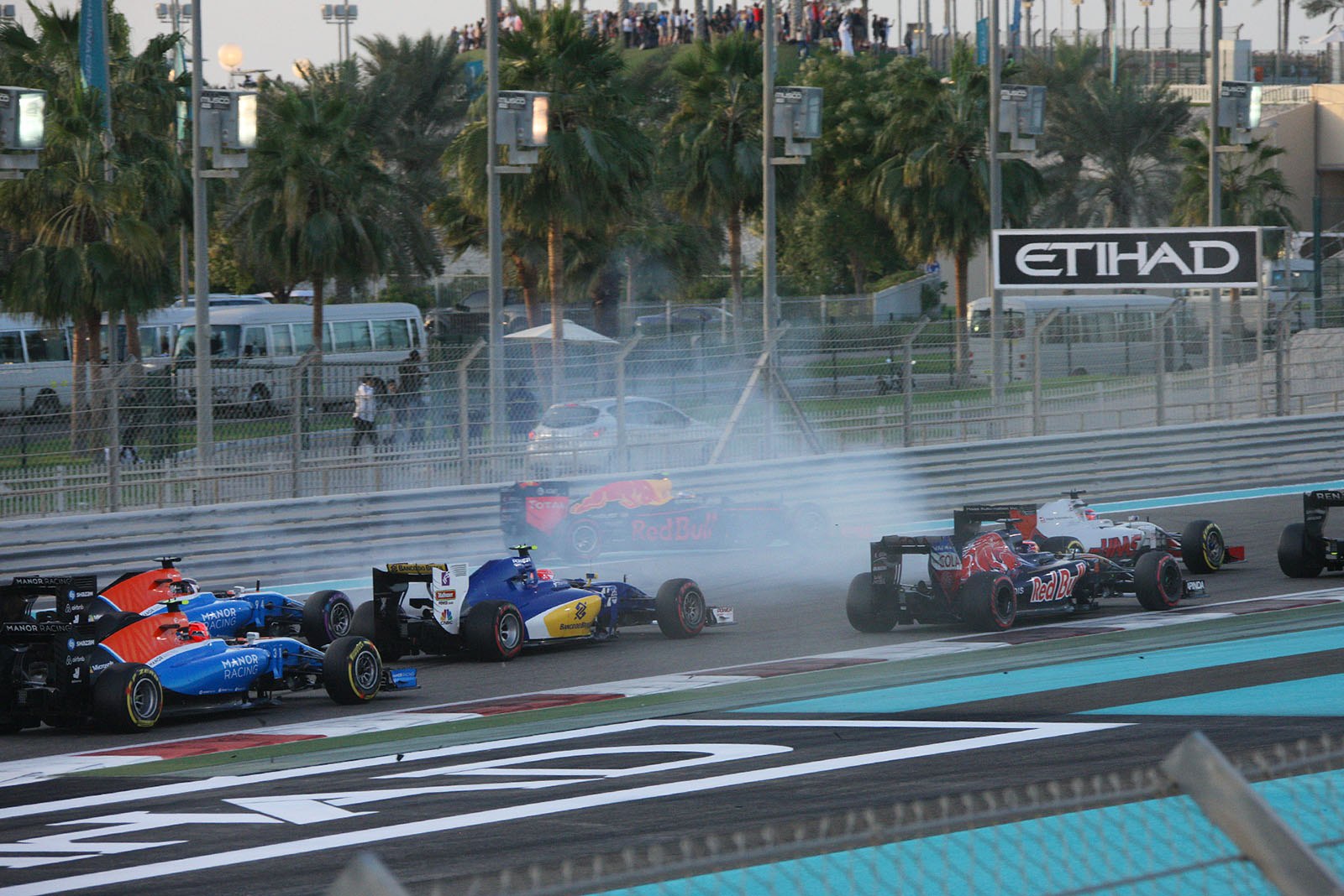 Awful start for Max Verstappen, Red Bull, as he spins around first corner, Abu Dhabi Grand Prix, 2016