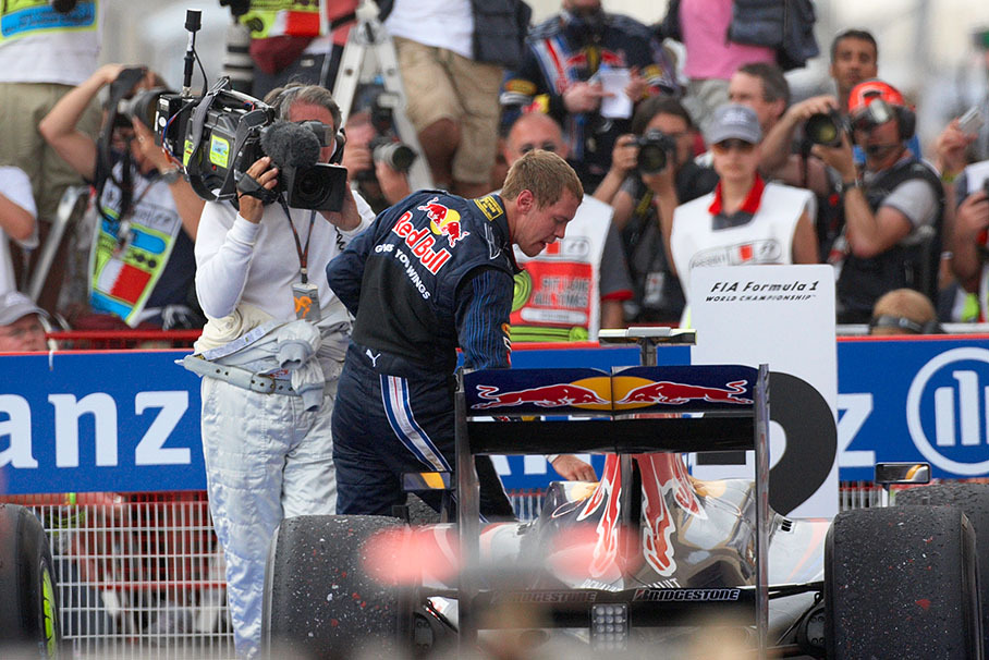 Second placed Sebastian Vettel in parc ferme besides his Red Bull car