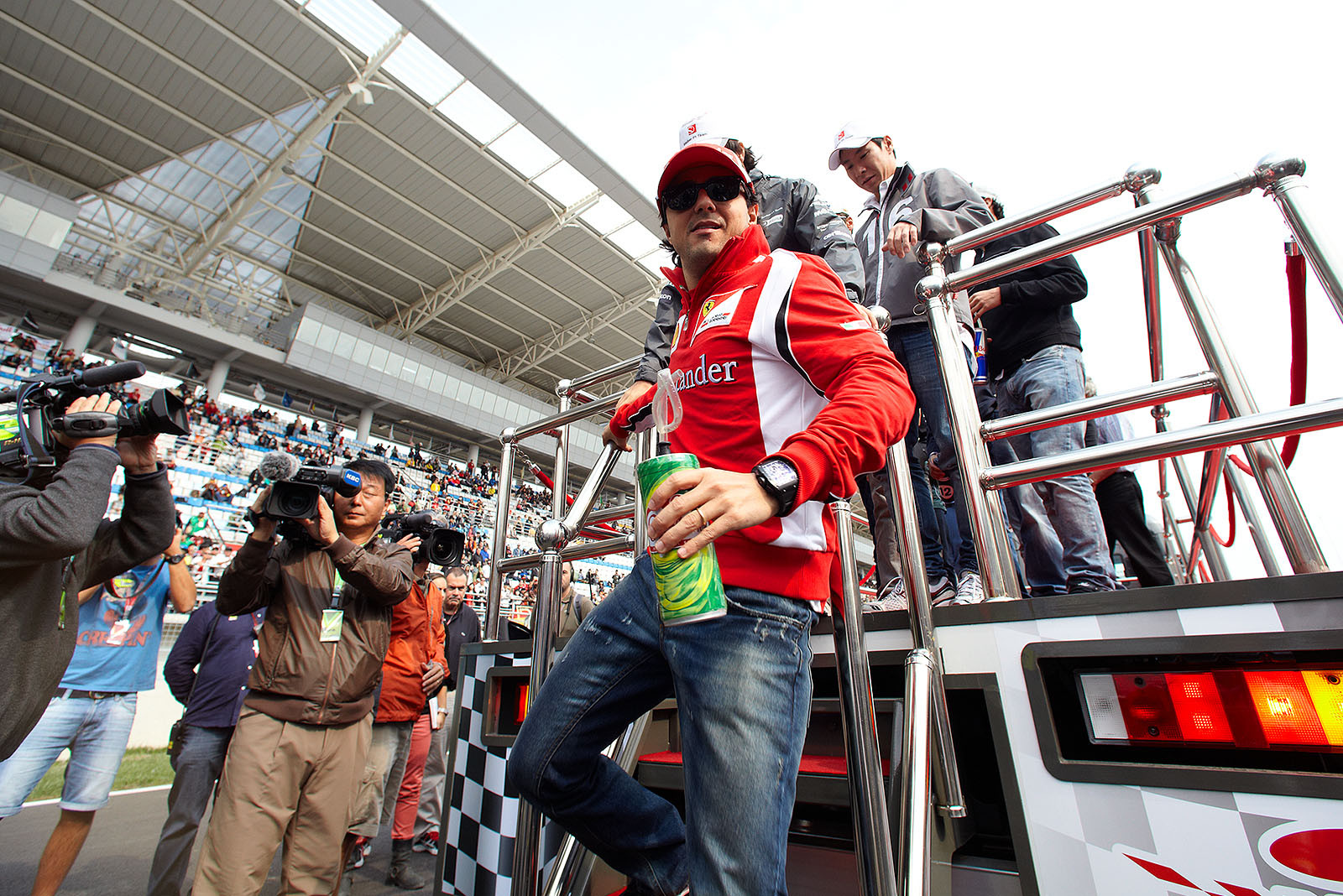 Felipe Massa, Ferrari, descends from drivers parade truck