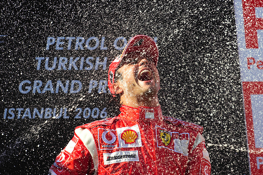 Victorious Felipe Massa being showered from all sides by a chilly champagne rain