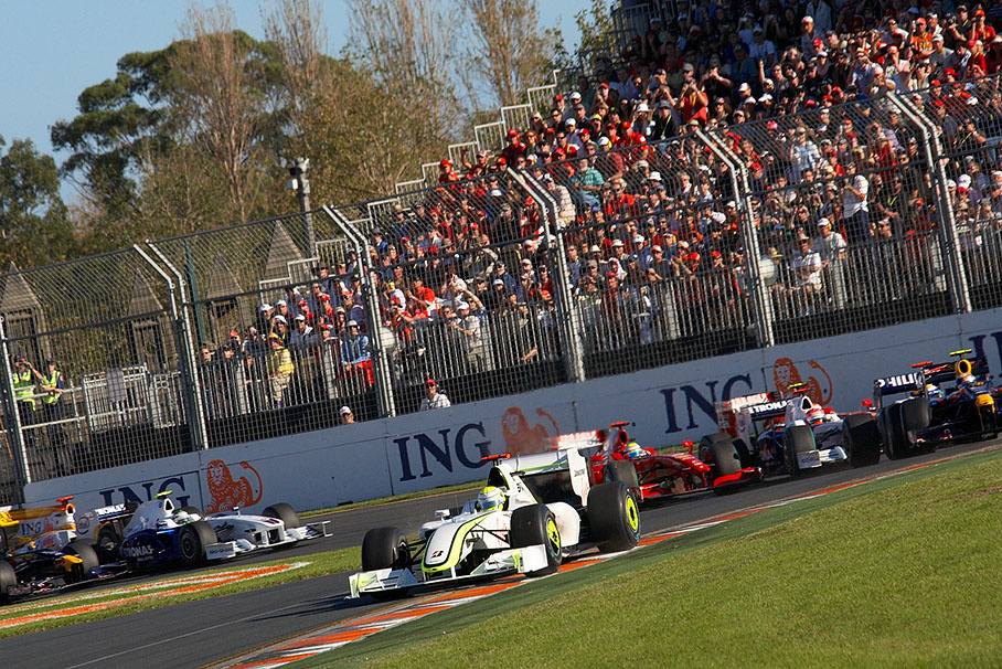 The start field enters first chicane, Jenson Button stays in front