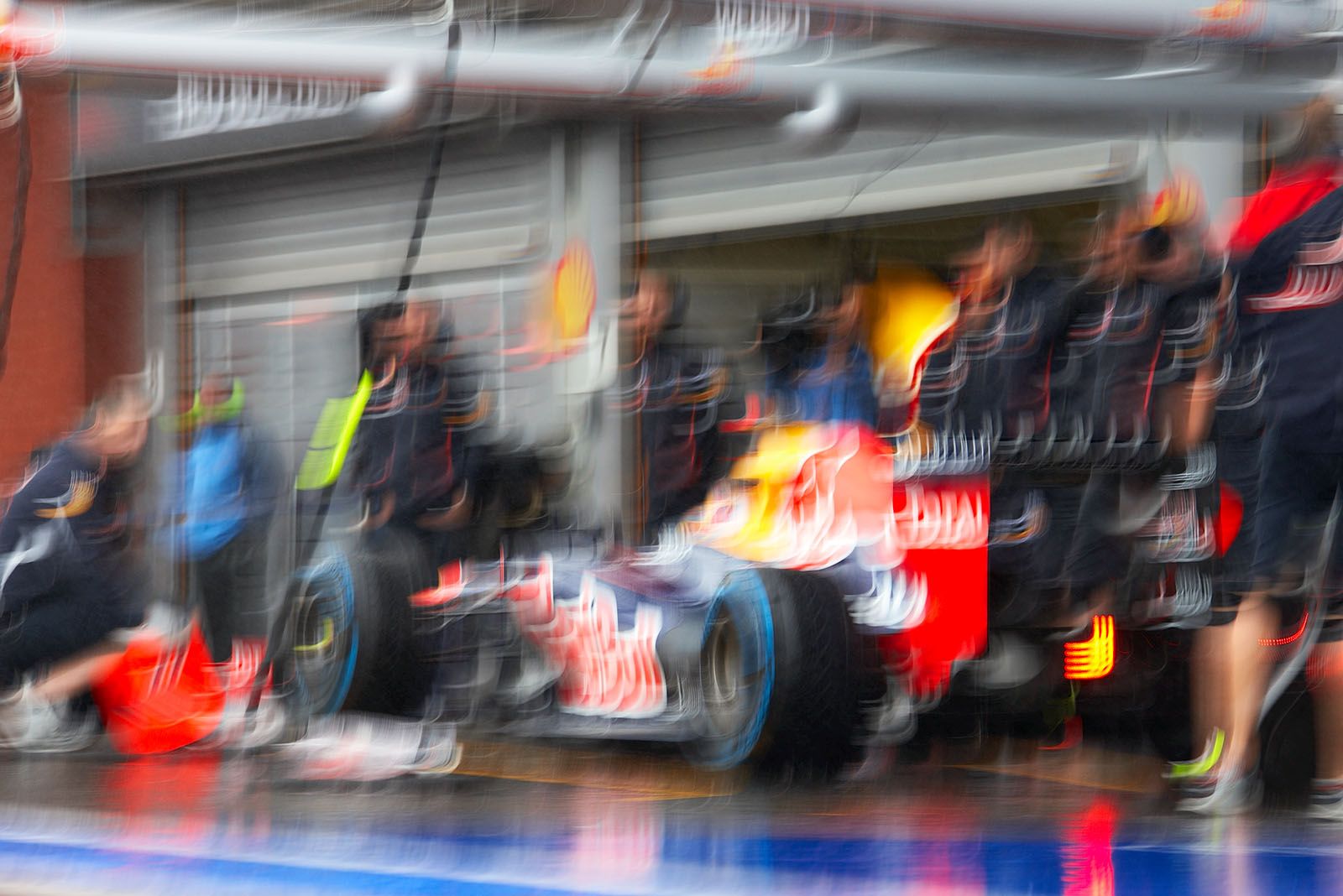 Sebastian Vettel comes to Red Bull pits and tests a stop under heavy rain
