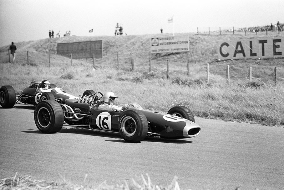 Race winner Jack Brabham on Brabham-Repco BT19 overtakes Jim Clark on Lotus-Climax 33, Dutch GP Zandvoort 1966