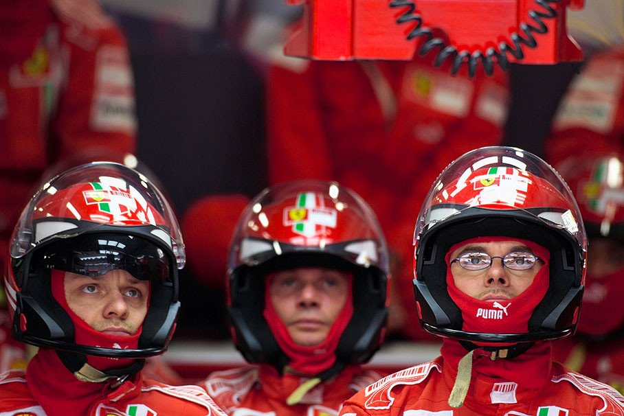Ferrari mechanis watch the race in pits