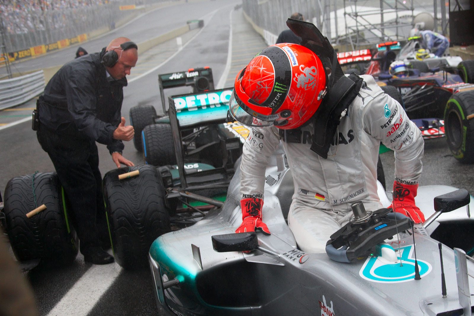 Michael Schumacher, Mercedes GP, returs from his declared last F1 deployment at seventh position and gets out of the car in parc ferme in front of the media