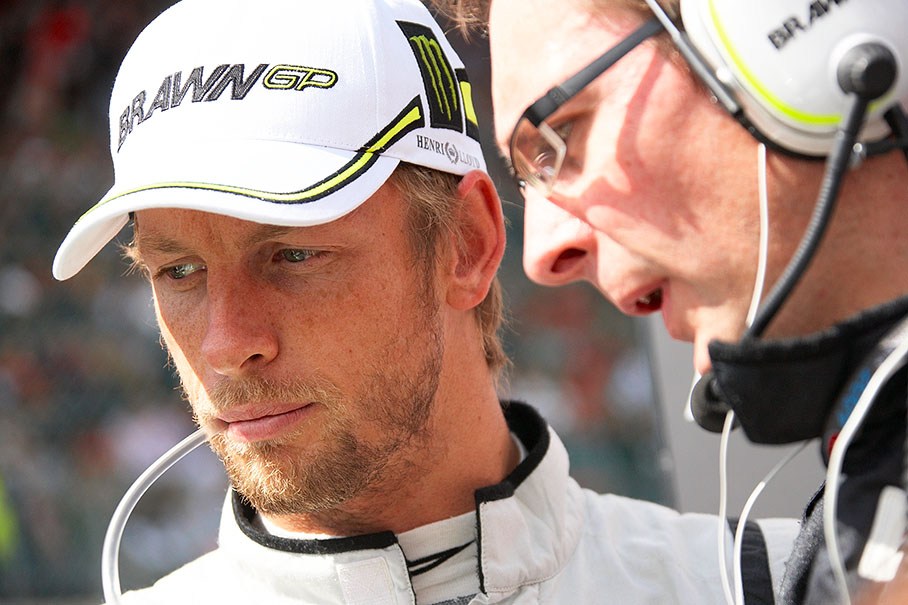 Jenson Button with his Brawn GP race engineer on the grid before the race