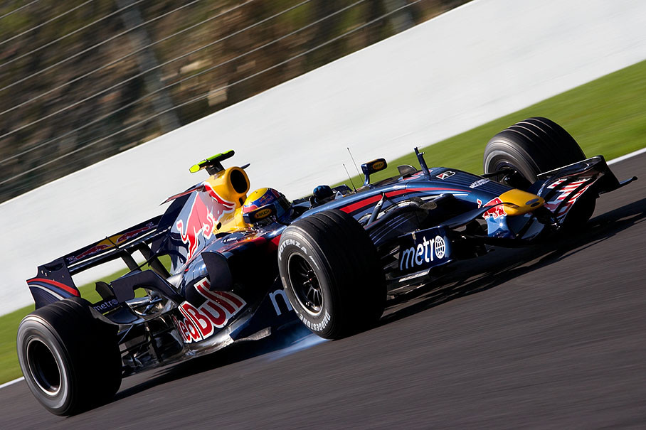 Red Bull rider Mark Webber brakes into La Source