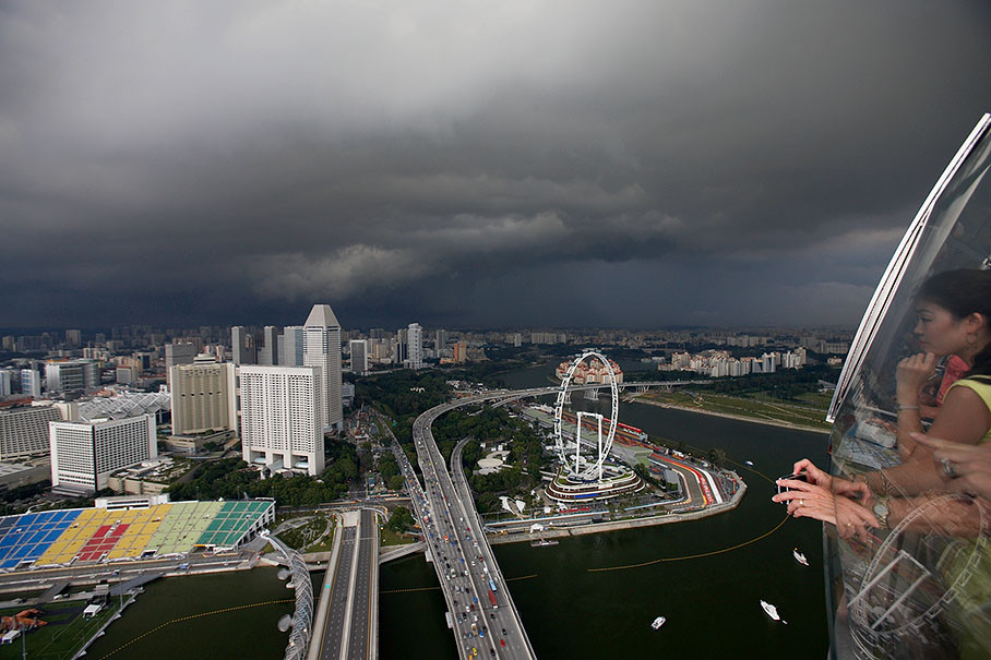 View from the top of the Hotel Marina Bay Sands skypark at the racetrack beneath a steel sky