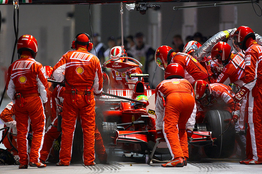 Felipe Massa at Ferrari pits watches the oldfashioned lollipop carefully