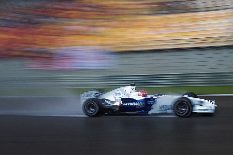 BMW Sauber driver Robert Kubica speeding through the rain