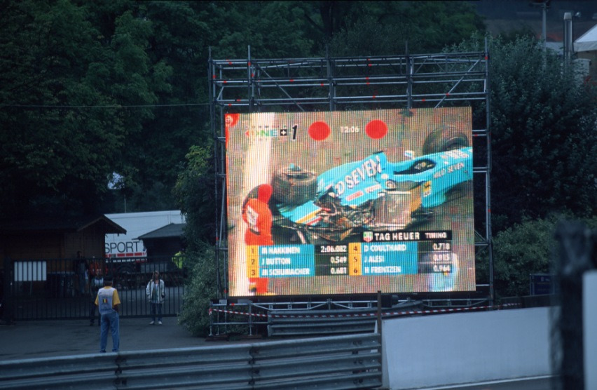 Big screen shows aftermath of Giancarlo Fisichella's crash (he escaped unhurt).