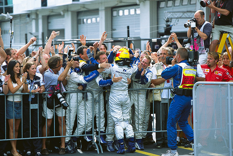 Ralf Schumacher hugging his mechanics