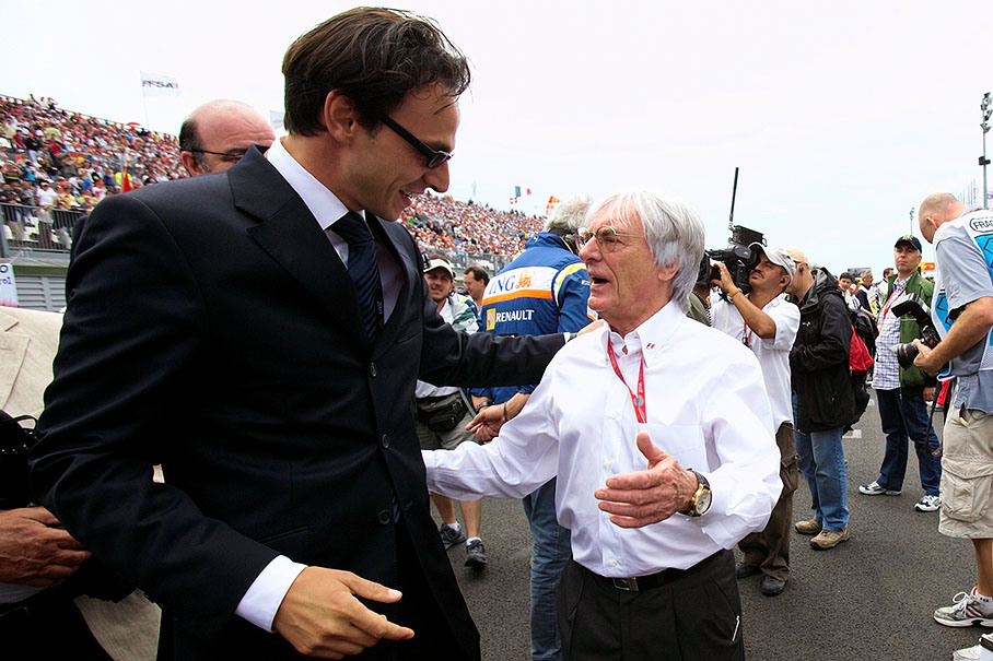 French motor federation chief Nicolas Deschaux is being warmly welcomed on the grid by F1 promotor Bernard Ecclestone