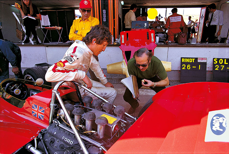 Austrian Jochen Rindt in pits together with his Lotus team-boss Colin Chapman during a practice session for the Spanish Grand Prix at Jarama