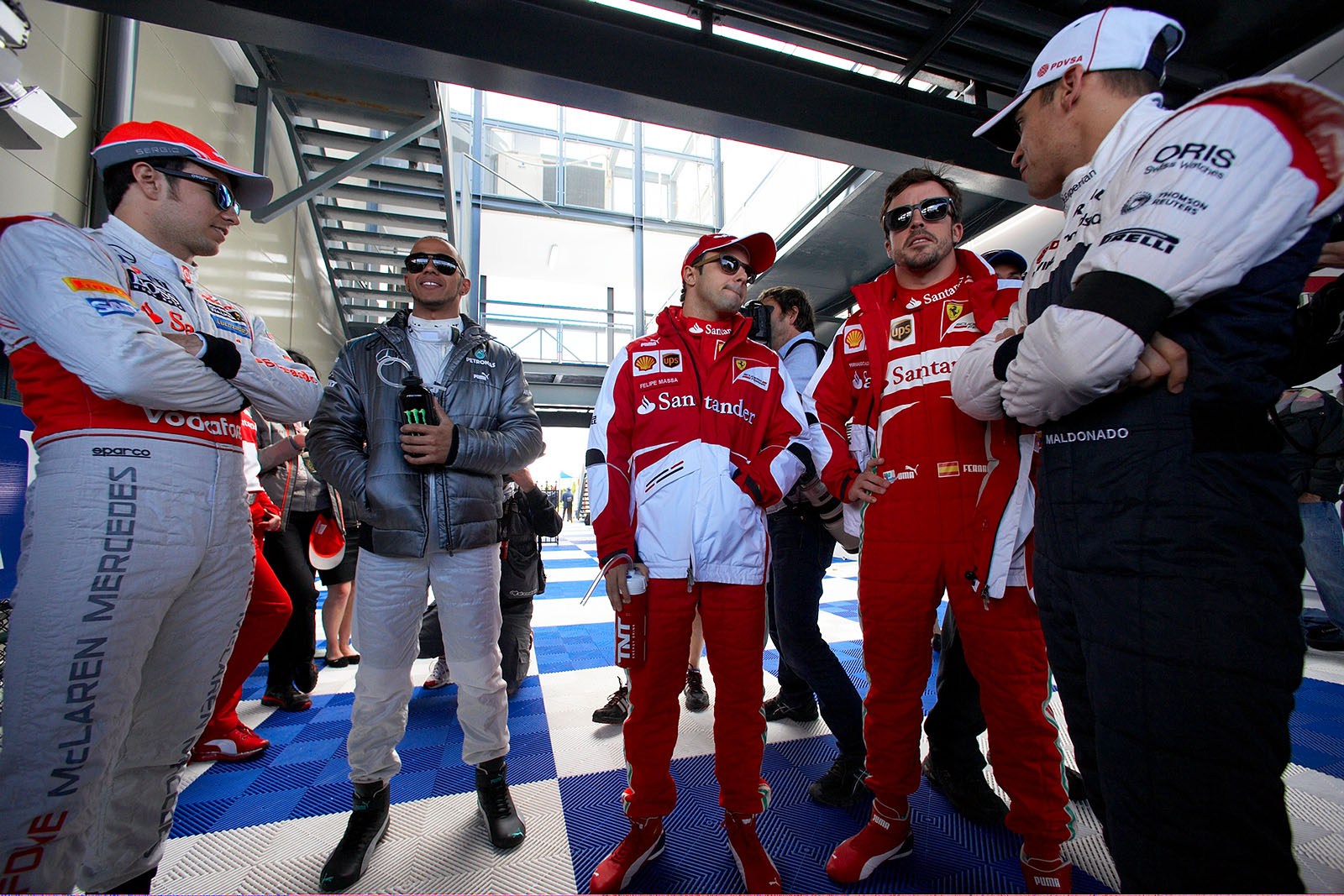 Race drivers wait for the drivers parade - McLarens Sergio Perez, Lewis Hamilton of Mercedes, Ferrari race drivers Massa and Alonso and Williams Maldonado
