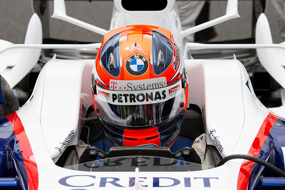 Robert Kubica, BMW Sauber, squeezed into the safe cockpit of his car on the grid position