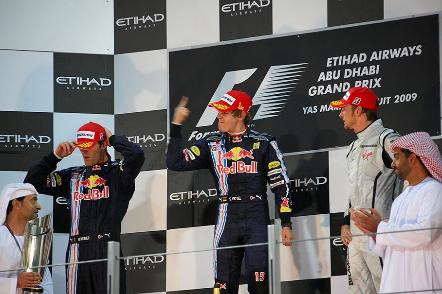Race winner Sebastian Vettel celebrates on Abu Dhabi's podium