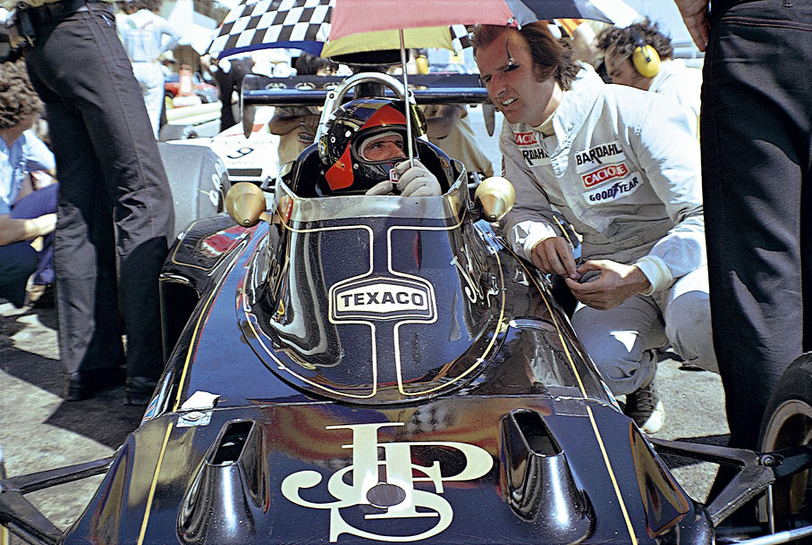 Emerson Fittipaldi iin the cockpit. His brother Wilson next to him.