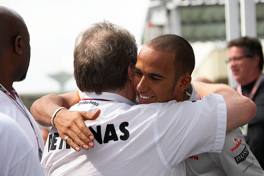 Mercedes Sport Director Norbert Haug hugs McLaren's Lewis Hamilton