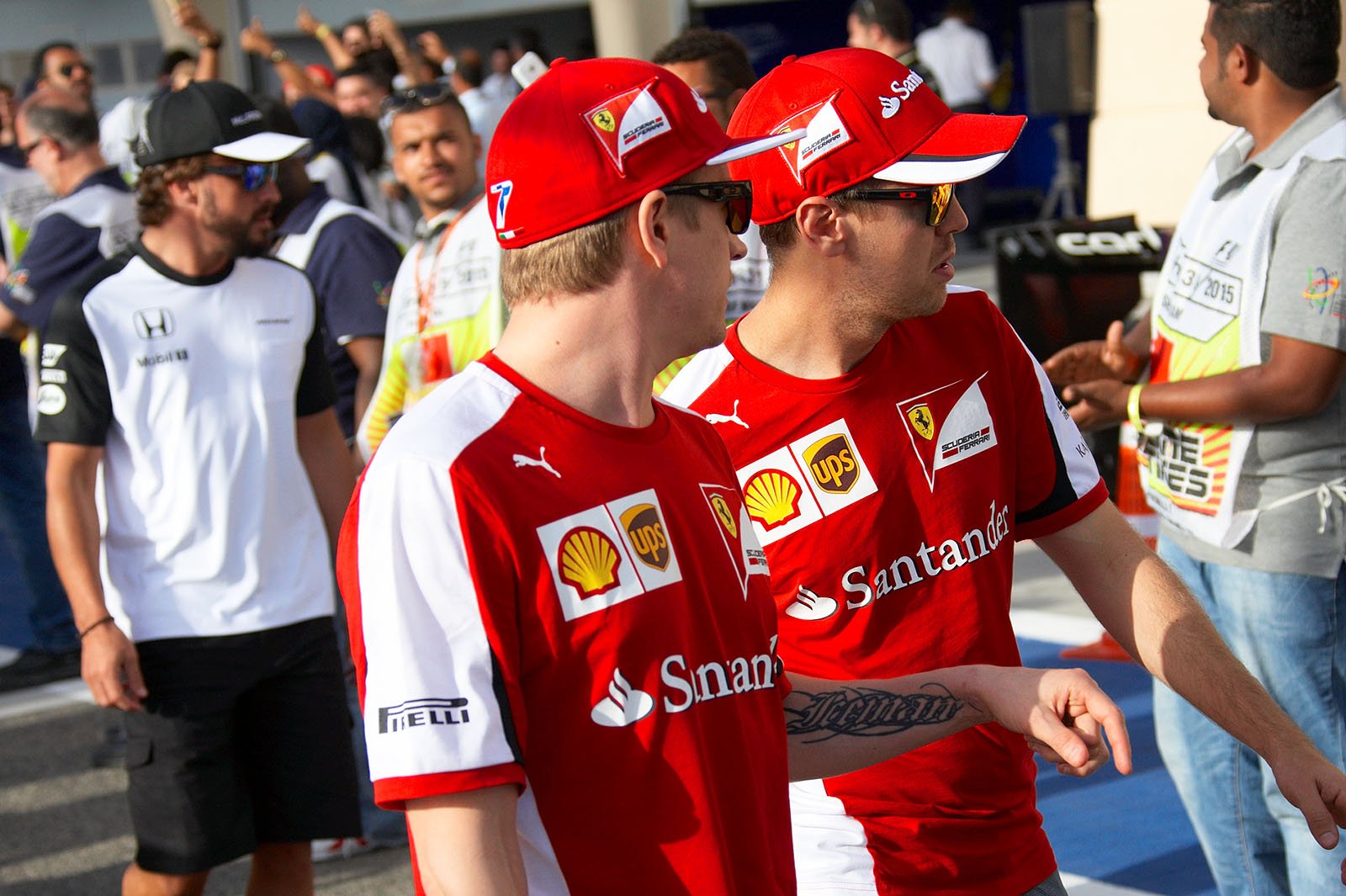 Kimi Raikkonen and Sebastian Vettel, Ferrari team-mates, Bahrain Grand Prix, 2015