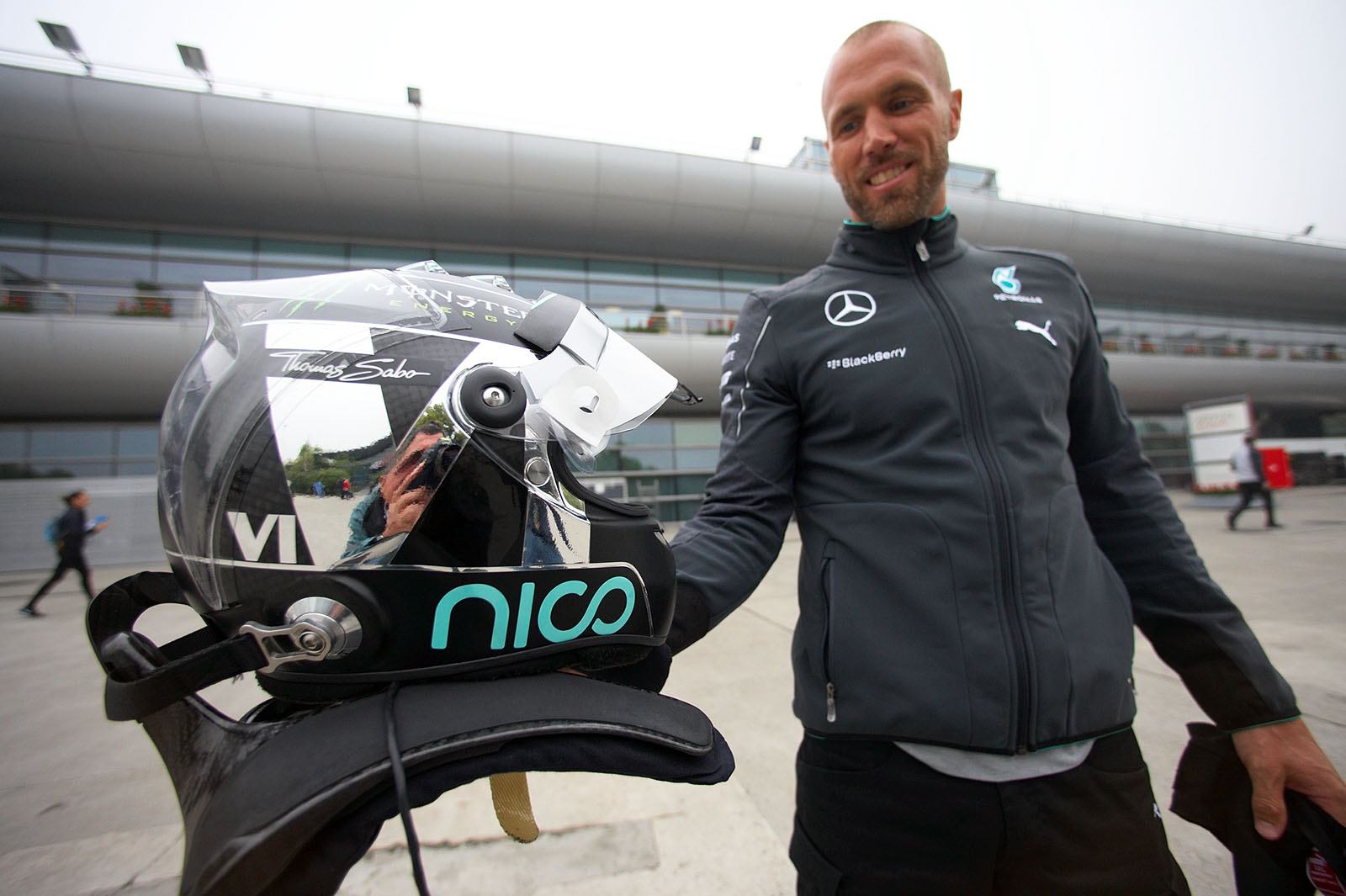 Nico Rosberg's physio, Daniel Schloesser, presents Nico's all new helmet for this season