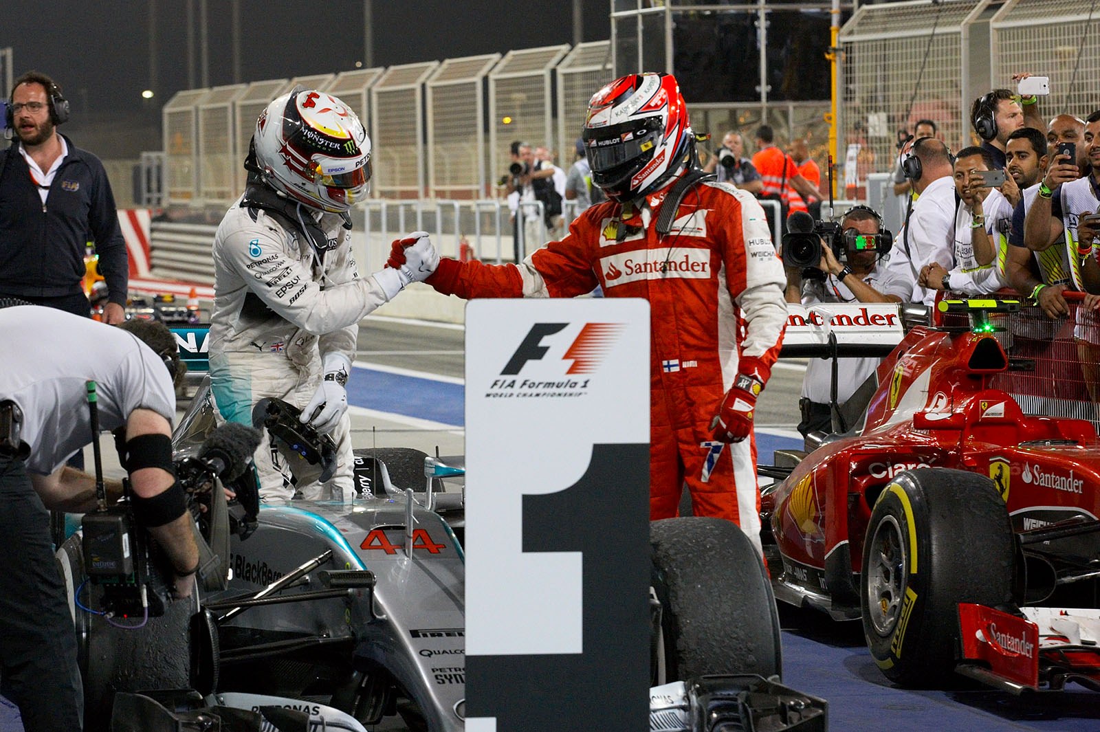 Kimi Raikkonen congratulates winner Lewis Hamilton for his 3rd victory in the first 4 races of the 2015 F1 season, Bahrain Grand Prix, 2015