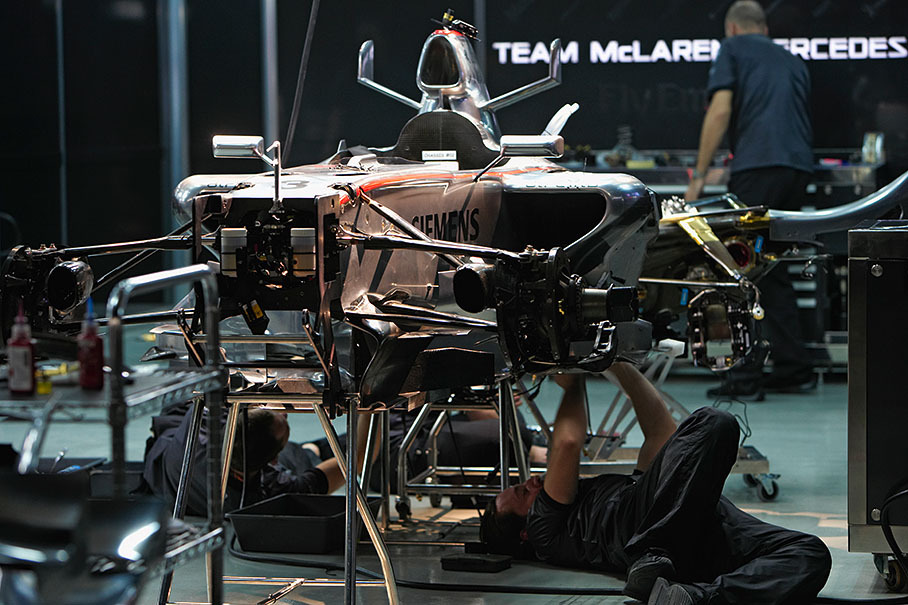 McLaren mechanics rebuilding Kimi's whole car on Friday afternoon