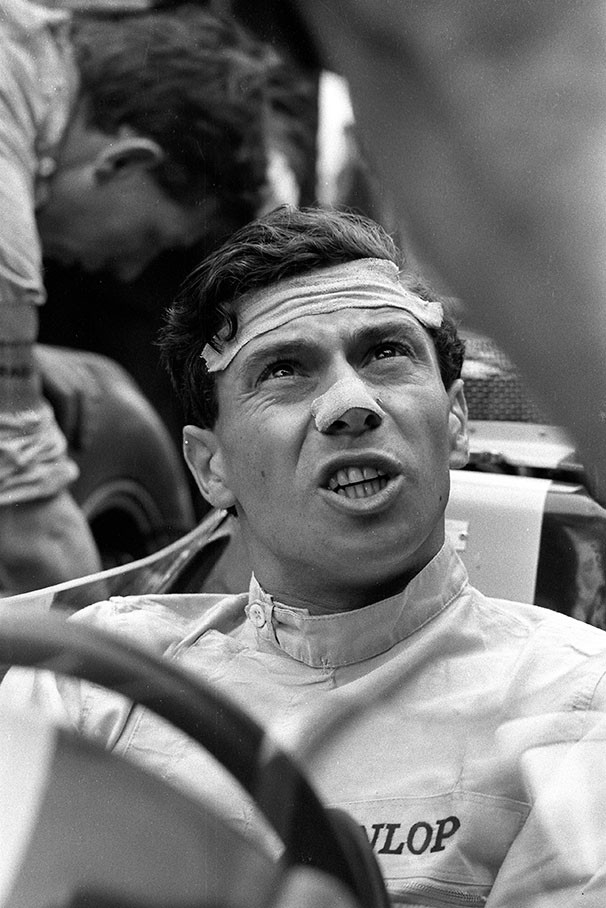 Jim Clark discusses the car setup during the Italian Grand Prix at Monza 1963.