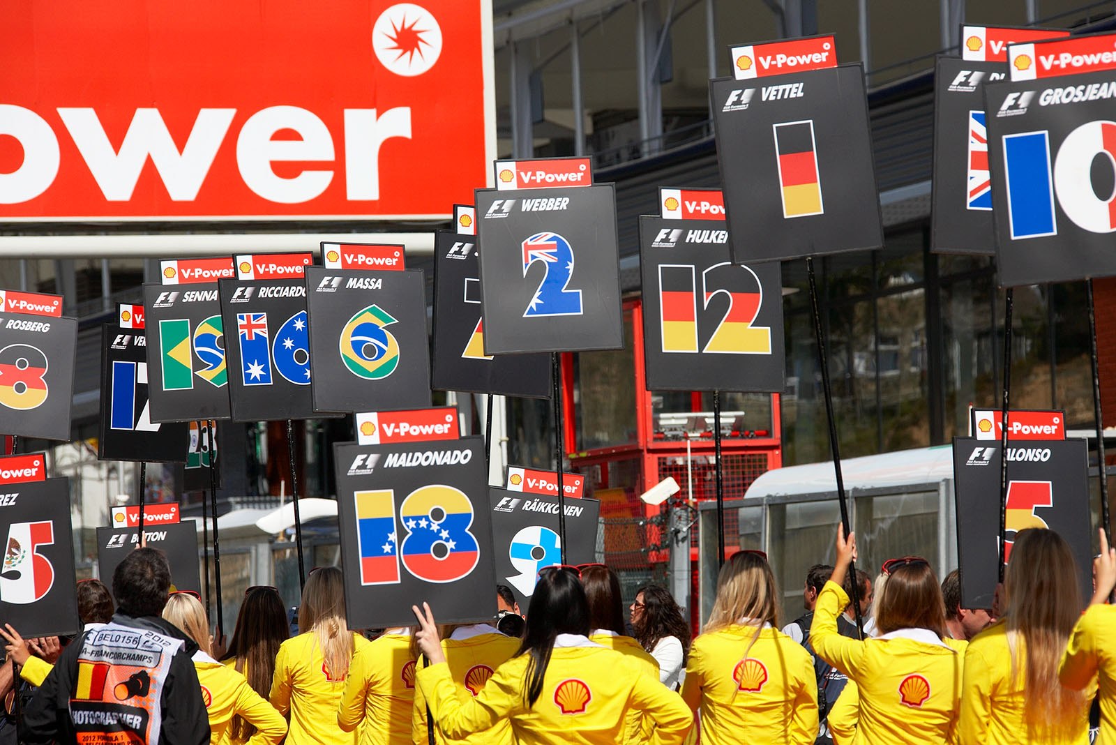 Grid girls raise their panels