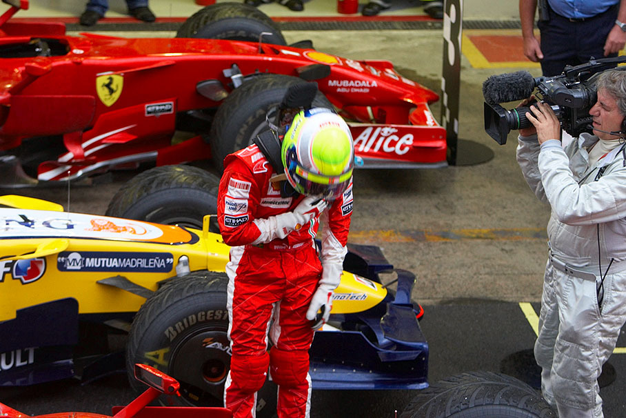 Overwhelmed by his feelings, in parc ferme after the final race Massa touches his heart and bows his head to honour his supporters in his home country