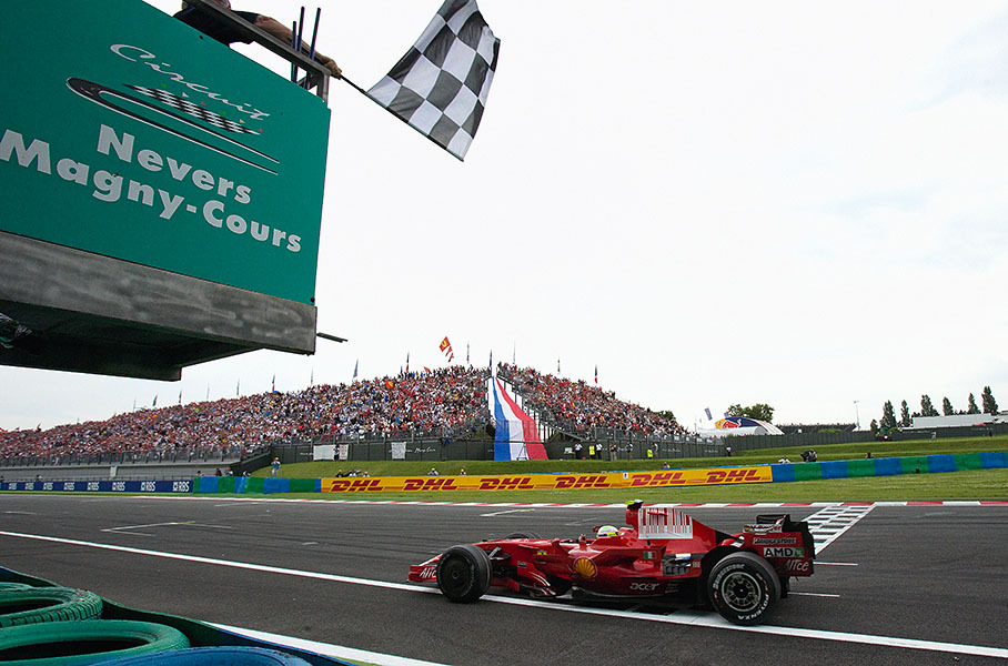 Felipe Massa takes the chequered flag and crosses the finish line
