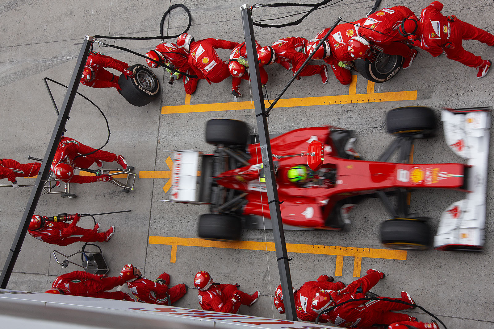 Felipe Massa ejects from Ferrari pits