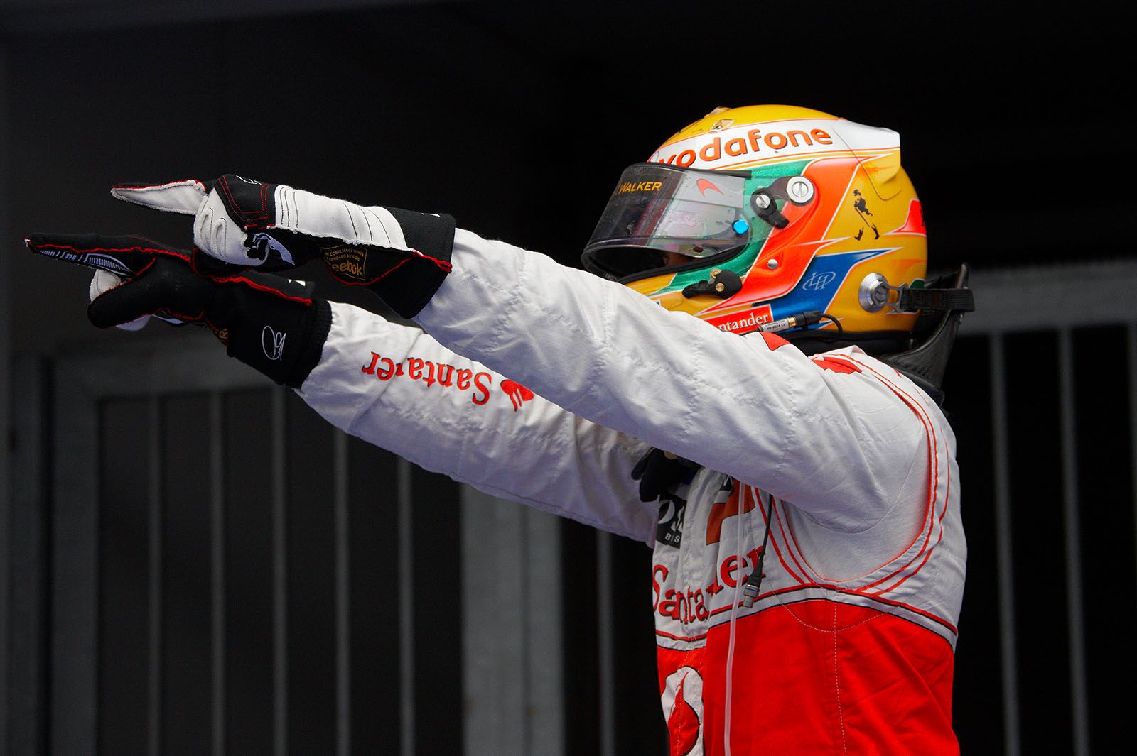 Race winner Lewis Hamilton of McLaren cheers in parc ferme after the race