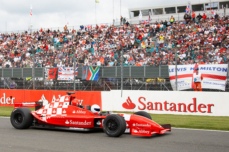 Sir Mick Jagger's daughter Jade dares to take a ride in the Santander two-seater race car, driven by BBC Top Gear's Stig